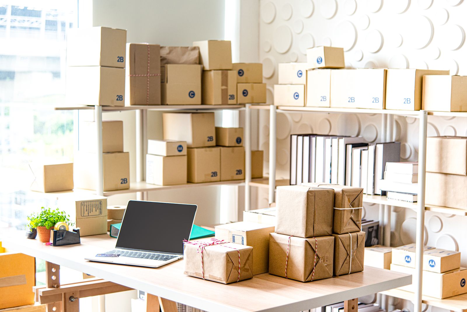 Boxed business stock on shelving