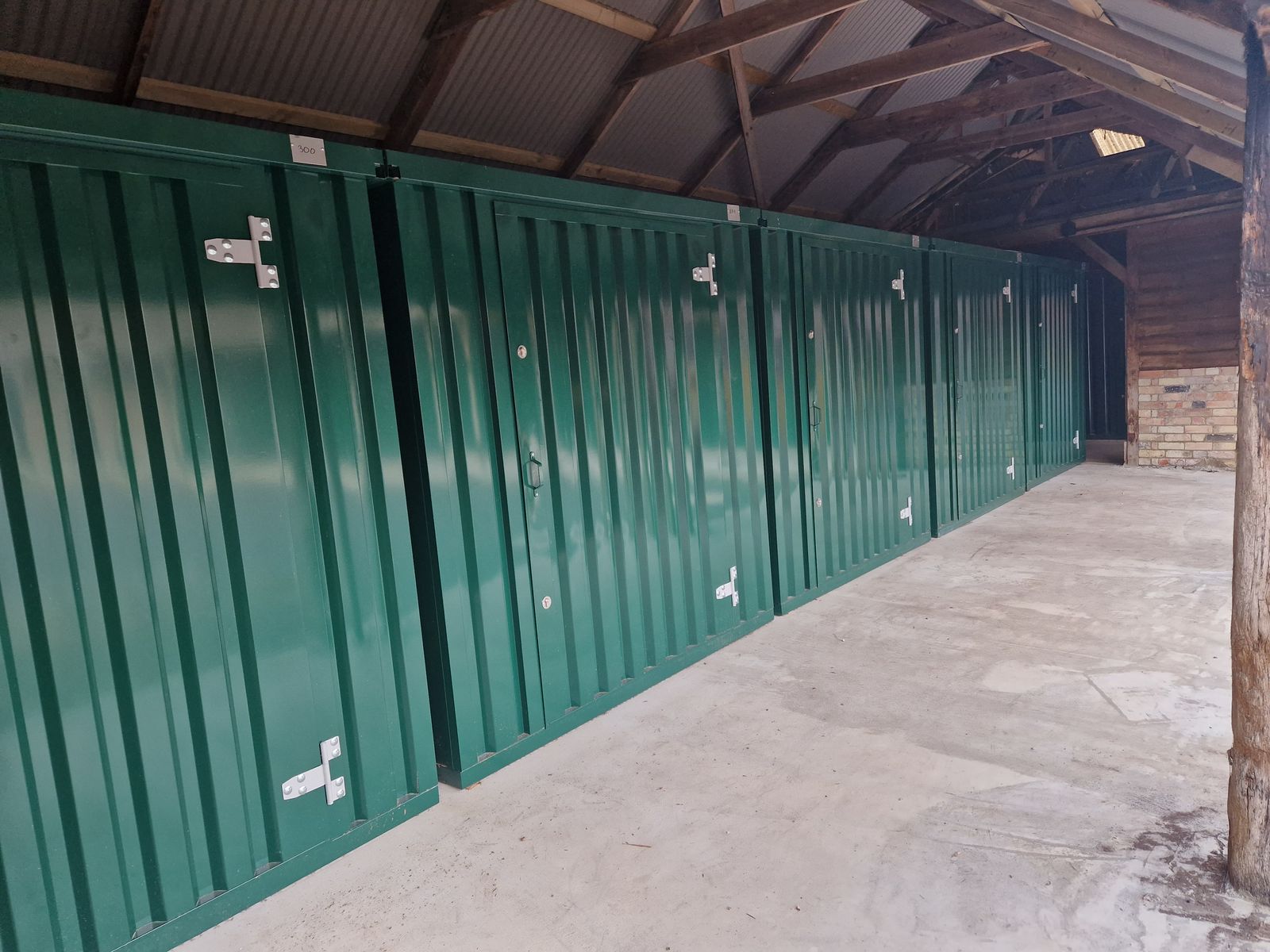 Row of green indoor storage units